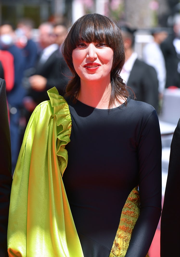 Karen O in a black-lime dress  at the Cannes Film Festival 2021