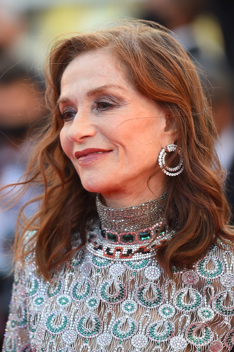 Isabelle Huppert in a green-silver sequin dress at the Cannes Film Festival 2021