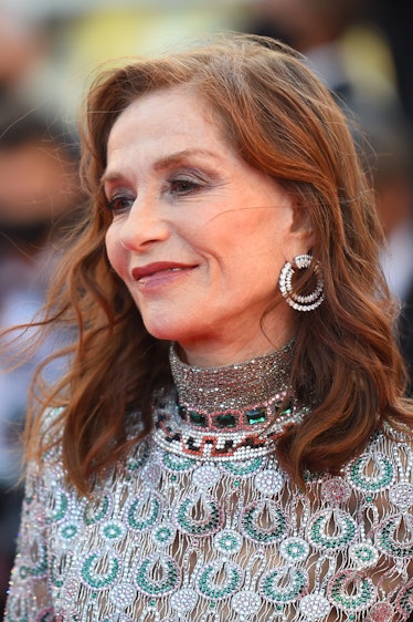 Isabelle Huppert in a green-silver sequin dress at the Cannes Film Festival 2021