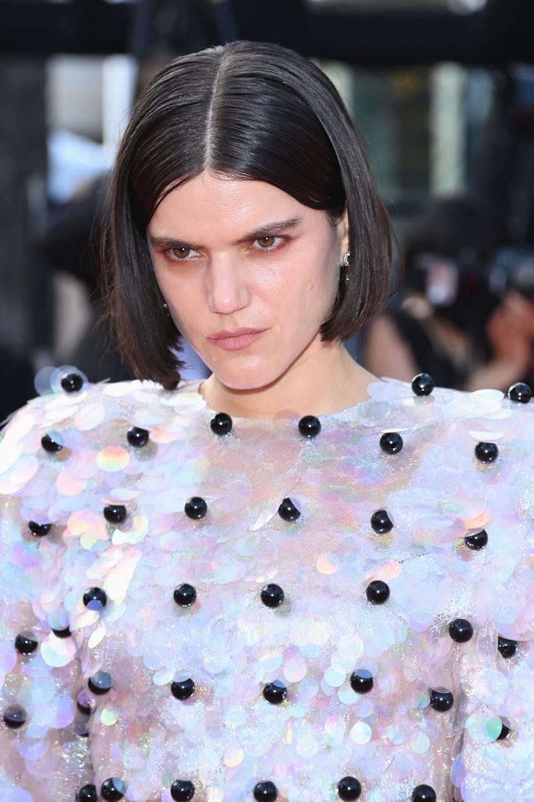 Soko in a white wide-paillette dress with black beads at the Cannes Film Festival 2021