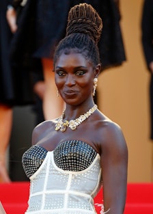 Jodie Turner-Smith in a black-white corset dress and a golden necklace at the Cannes Film Festival 2...