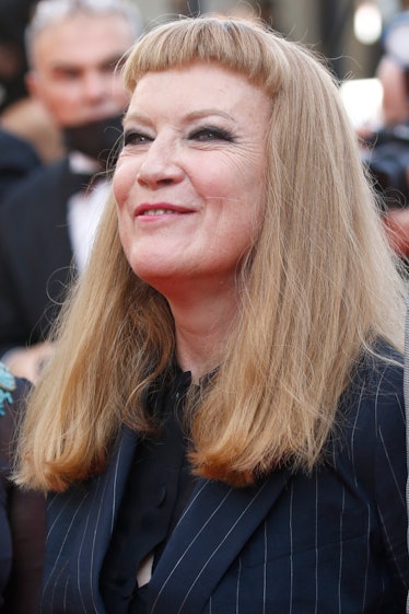 Andrea Arnold in a black blouse and a navy pinstripe blazer at the Cannes Film Festival 2021