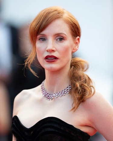 Jessica Chastain in a black heart-neckline dress and a small silver choker necklace