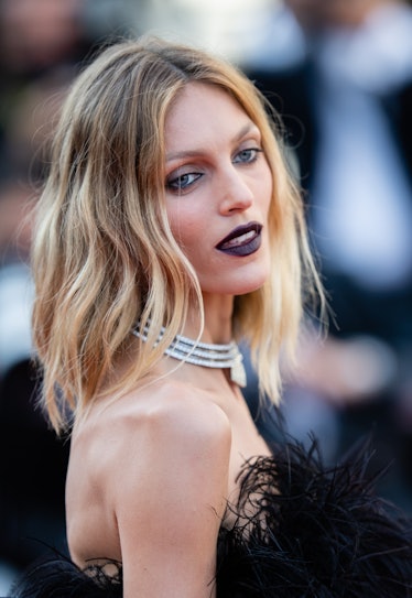 Anja Rubik in a black feather dress and diamond choker at the Cannes Film Festival 2021