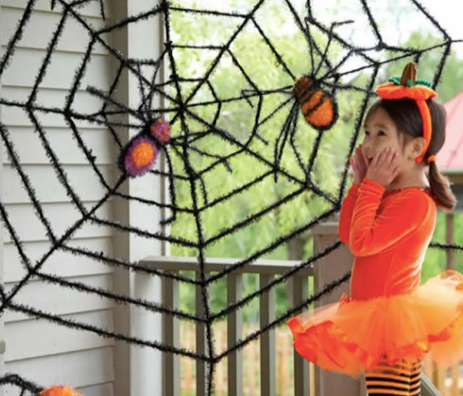 outdoor faux spiderweb decoration
