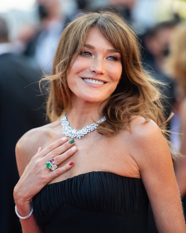 Carla Bruni in a black dress and a diamond necklace  at the Cannes Film Festival 2021