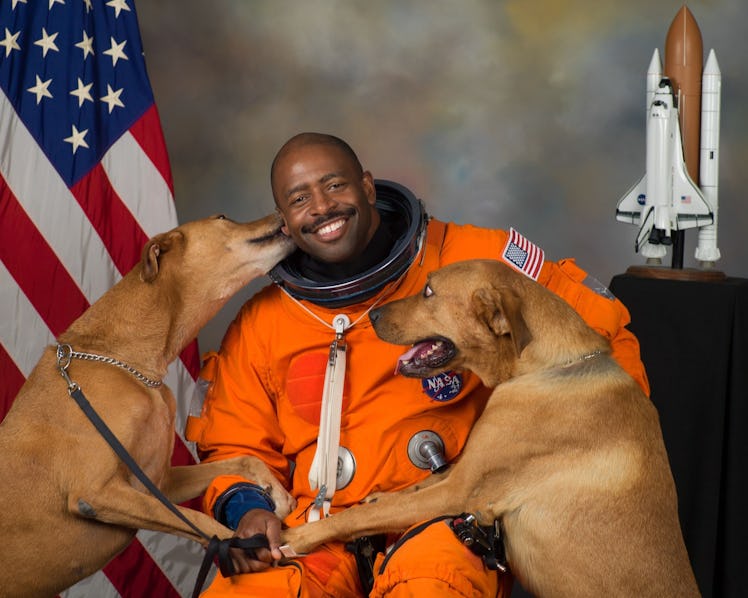 Astronaut Leland Melvin with his two dogs.