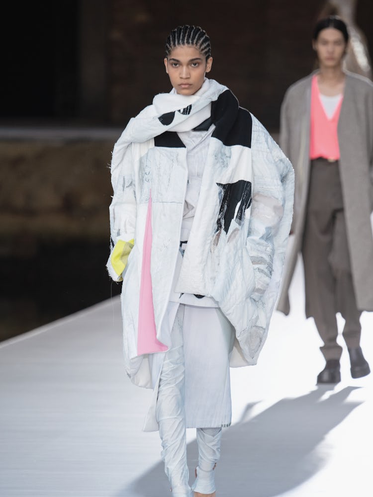 A model in a white-black oversized jacket and pants at the Valentino Couture Fall 2021 Couture