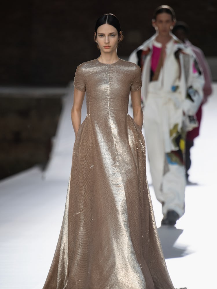 A model in a beige sequin gown at the Valentino Couture Fall 2021 Couture