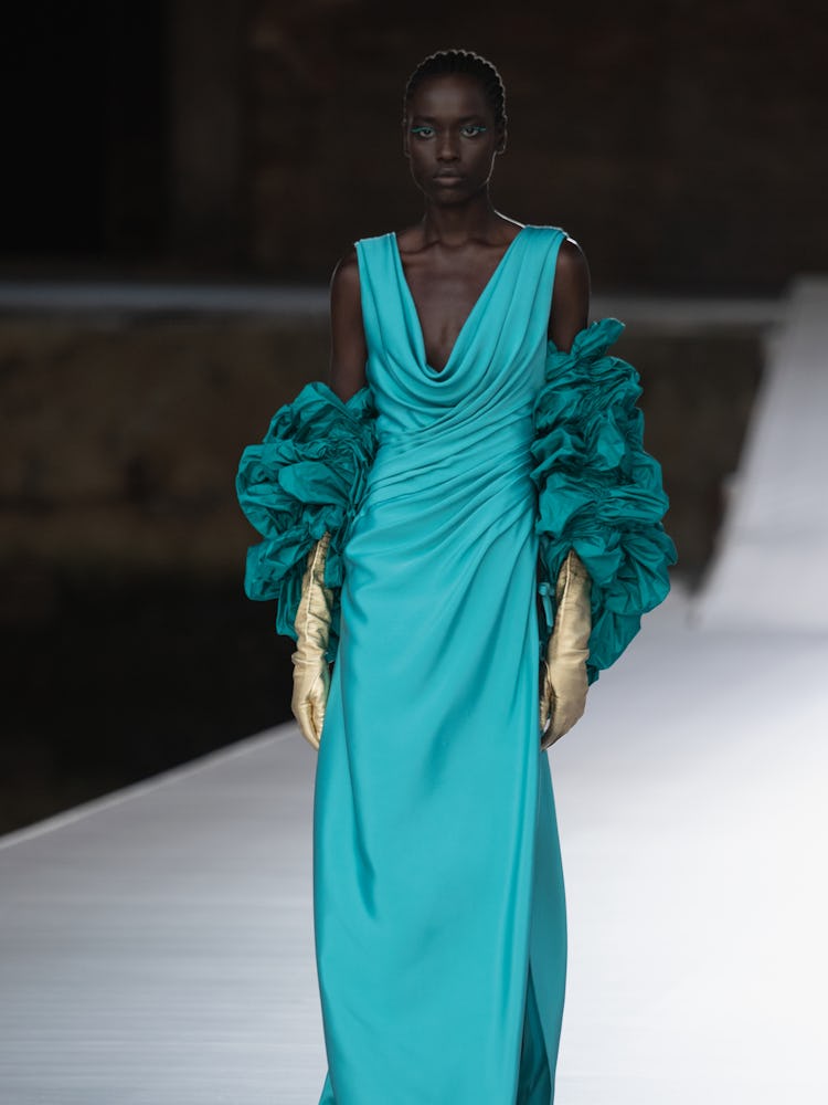 A model in a blue draped dress at the Valentino Couture Fall 2021 Couture