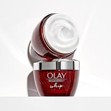A flat lay product shot of Olay's Regenerist Whip Face Moisturizer
