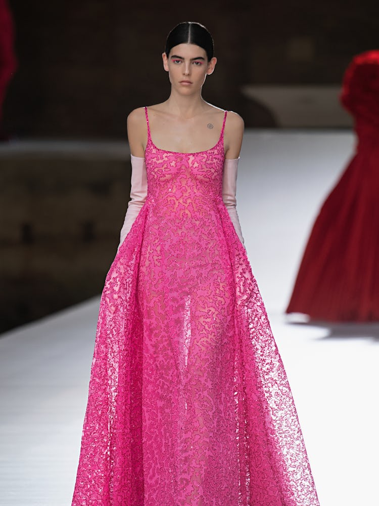 A model in a pink lace dress at the Valentino Couture Fall 2021 Couture