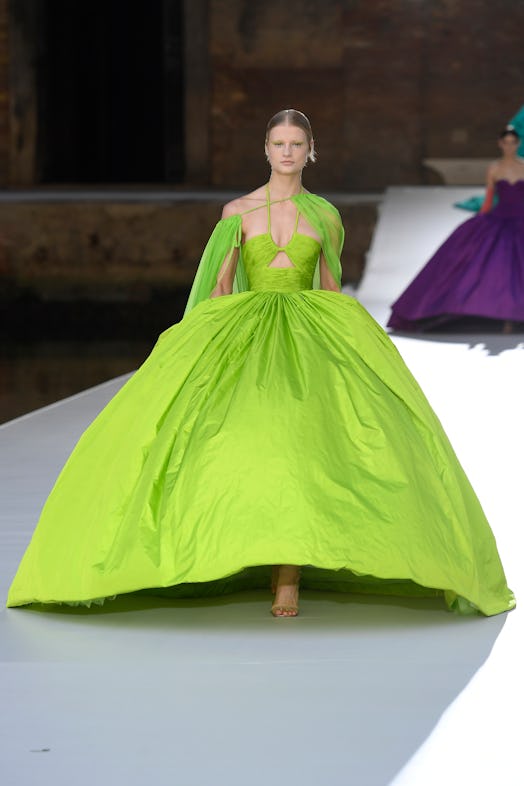 A model in a lime asymmetric gown at the Valentino Couture Fall 2021 Couture