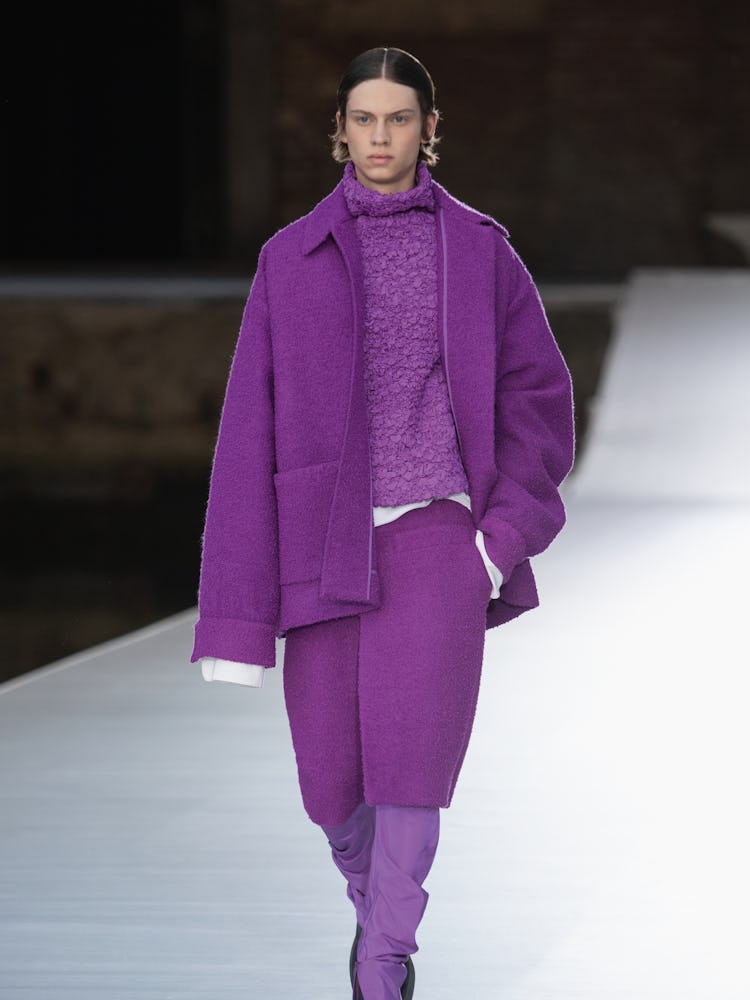 A model in a purple jacket, top, pants at the Valentino Couture Fall 2021 Couture