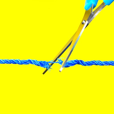Scissors cutting through string