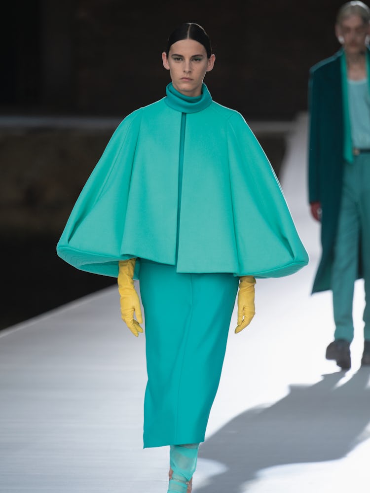 A model in a teal top and skirt at the Valentino Couture Fall 2021 Couture