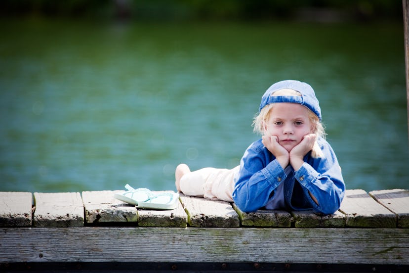 Homesick Kids: View Of Bored Child On Dock