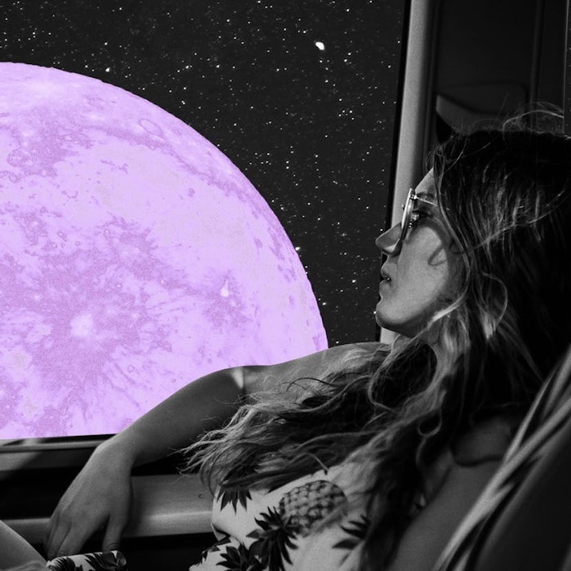 Young woman looking at the July 2021 full moon, which will affect her the most, per her zodiac sign.