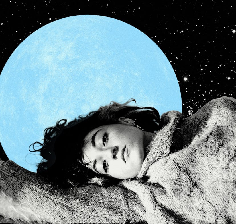 Young woman laying down with the blue moon behind her to show how the July 2021 full moon in Aquariu...