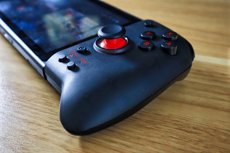 Hori Split Pad Pro review: Controller in translucent black showing analog joystick and ABXY buttons.