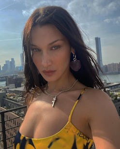 Bella Hadid taking selfie on rooftop