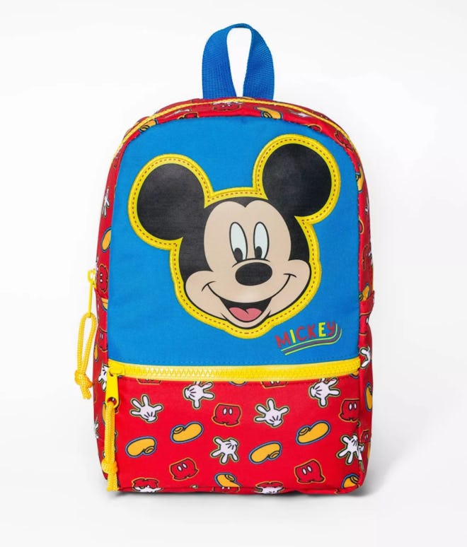 Red, blue, and yellow backpack with Mickey Mouse face 