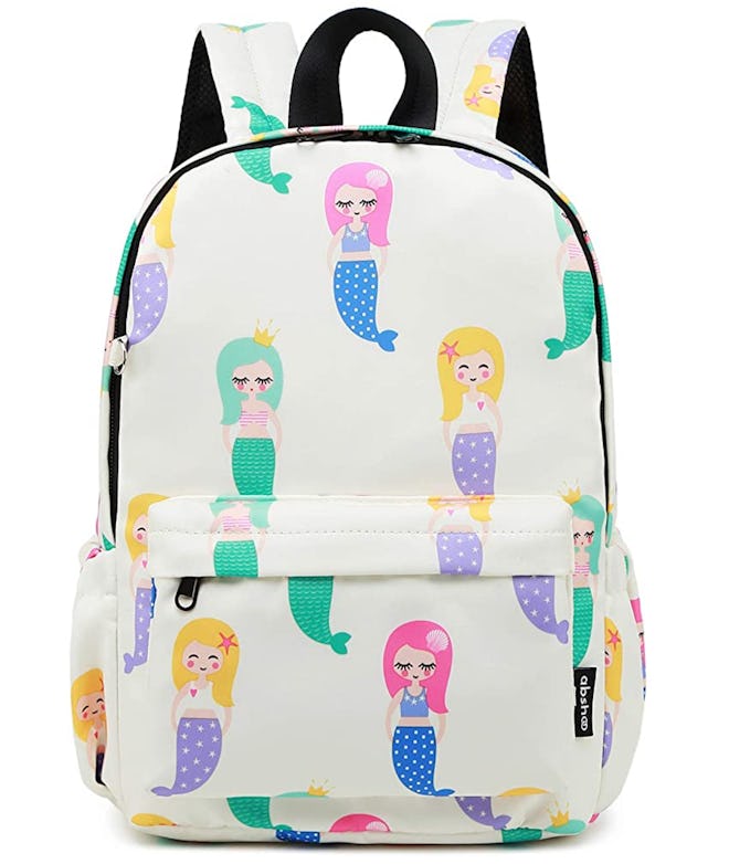 White backpack with colorful cartoon mermaids printed on it