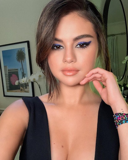 While promoting her partnership with the youth empowerment program We Charity, Selena Gomez rocked a shimmery purple cat eye.