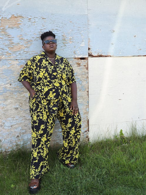 Lydia Okello wears a yellow and black, printed two-piece set.