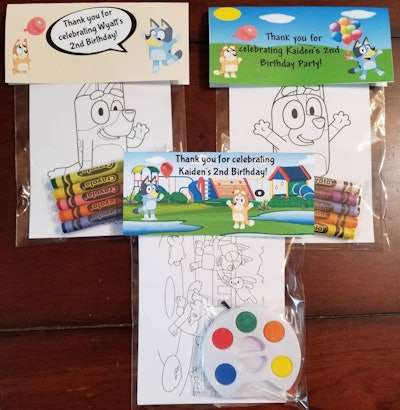 3 Coloring packets with crayons, paint, and coloring pages that feature characters from "Bluey"
