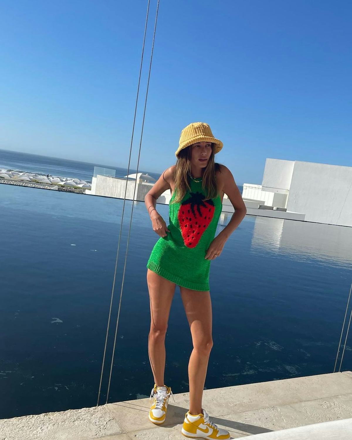 Hailey Bieber in green strawberry dress.