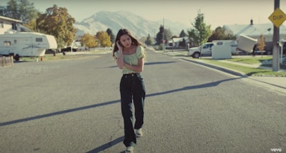 Olivia Rodrigo in Driver's License music video wearing black jeans and smocked green top
