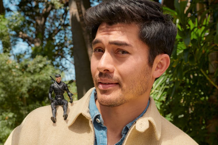 Golding poses with an action figure of himself from Snake Eyes.