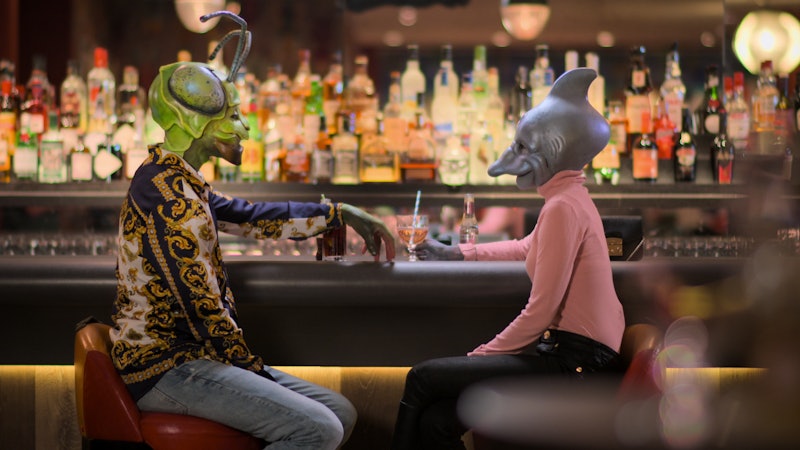Two contestants from 'Sexy Beasts' on a date, dressed as a praying mantis and a dolphin.