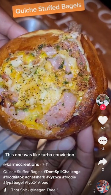 A woman holds up a quiche-stuffed bagel from TikTok that she made with a recipe. 