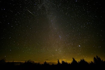 In this 30 second exposure, a meteor streaks across the sky during the annual Perseid meteor shower ...
