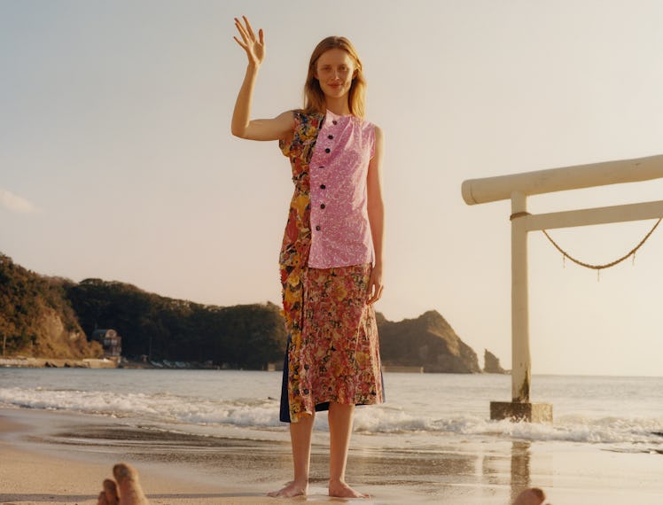 The model Rianne van Rompaey wearing a colorful outfit on a beach in Japan
