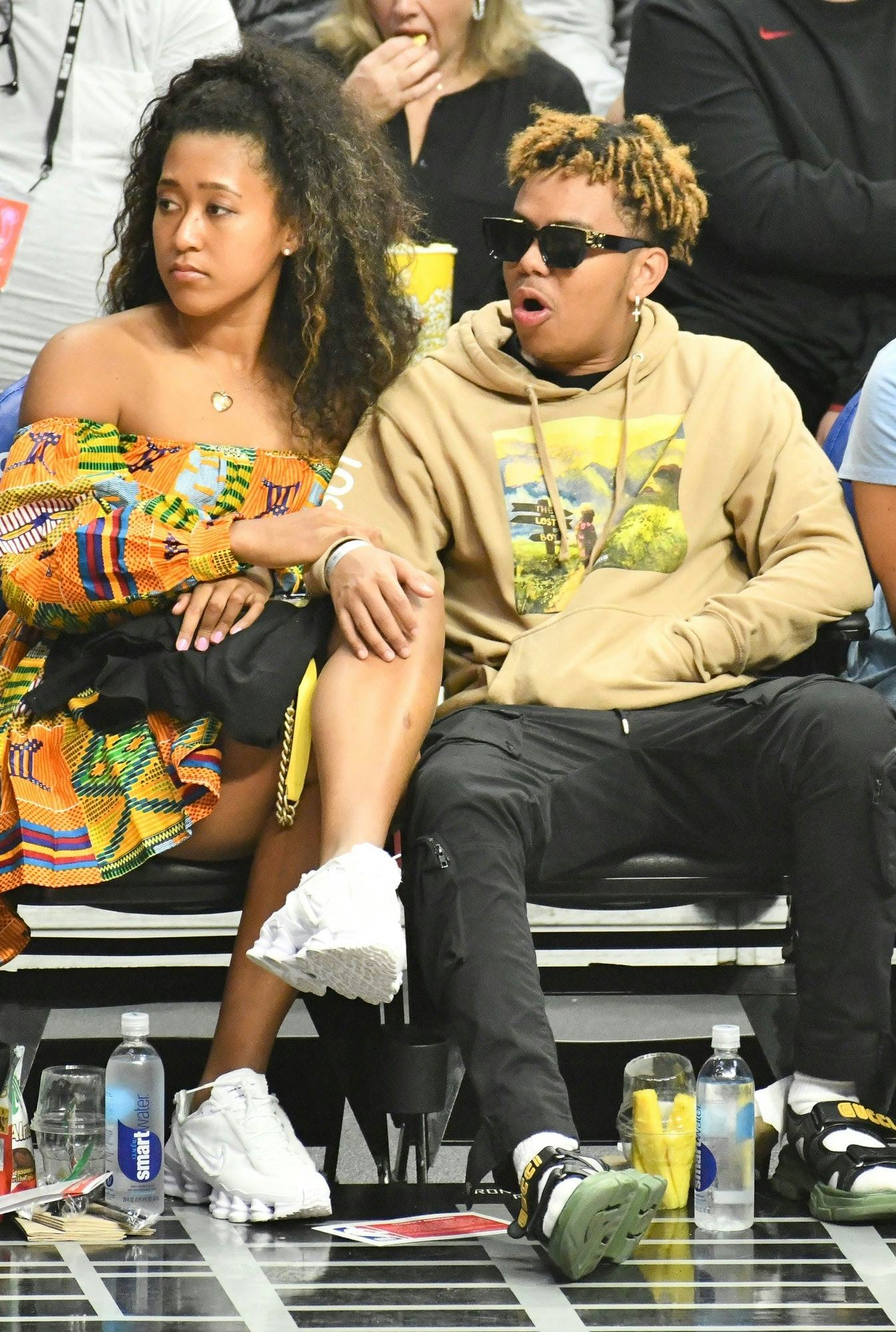 Tennis legend Naomi Osaka and rapper Cordae make sure to support each other in their individual ende...