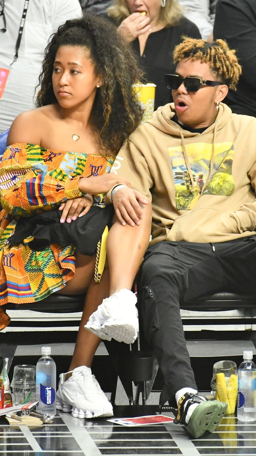 Tennis legend Naomi Osaka and rapper Cordae make sure to support each other in their individual ende...