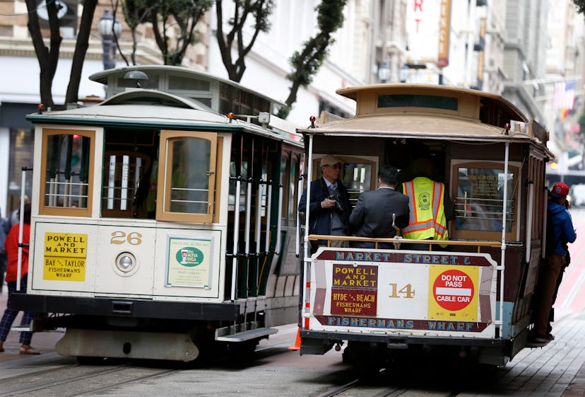 Two cable cars in San Francisco driving next to one another