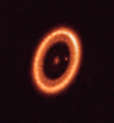 A red-orange disc circles the sun PDS 70 and two planets.