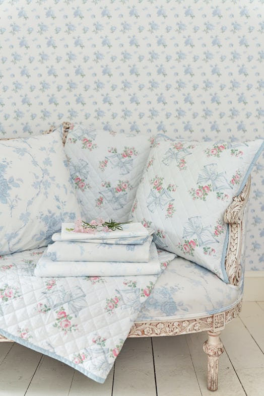 LoveShackFancy's new wallpaper and bedding includes whimsical blue and pink prints
