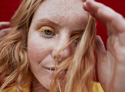 Scared young woman looking into the camera, showing her most secret fear, according to her zodiac si...