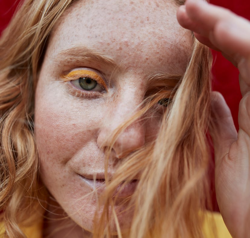 Scared young woman looking into the camera, showing her most secret fear, according to her zodiac si...