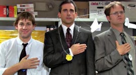 Jim Halpert, Michael Scott, and Dwight Schrute stand on podiums for 'The Office' Olympics episode.