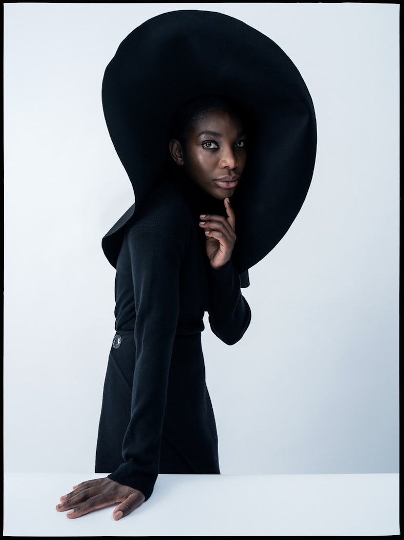 Michaela Coel in  Loro Piana turtleneck; Givenchy skirt and hat. Hair by Cyndia Harvey at Art Partne...
