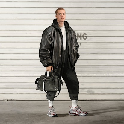 Justin Bieber with a Balenciaga handbag. 