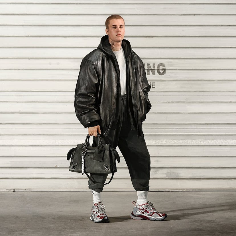 Justin Bieber with a Balenciaga handbag.