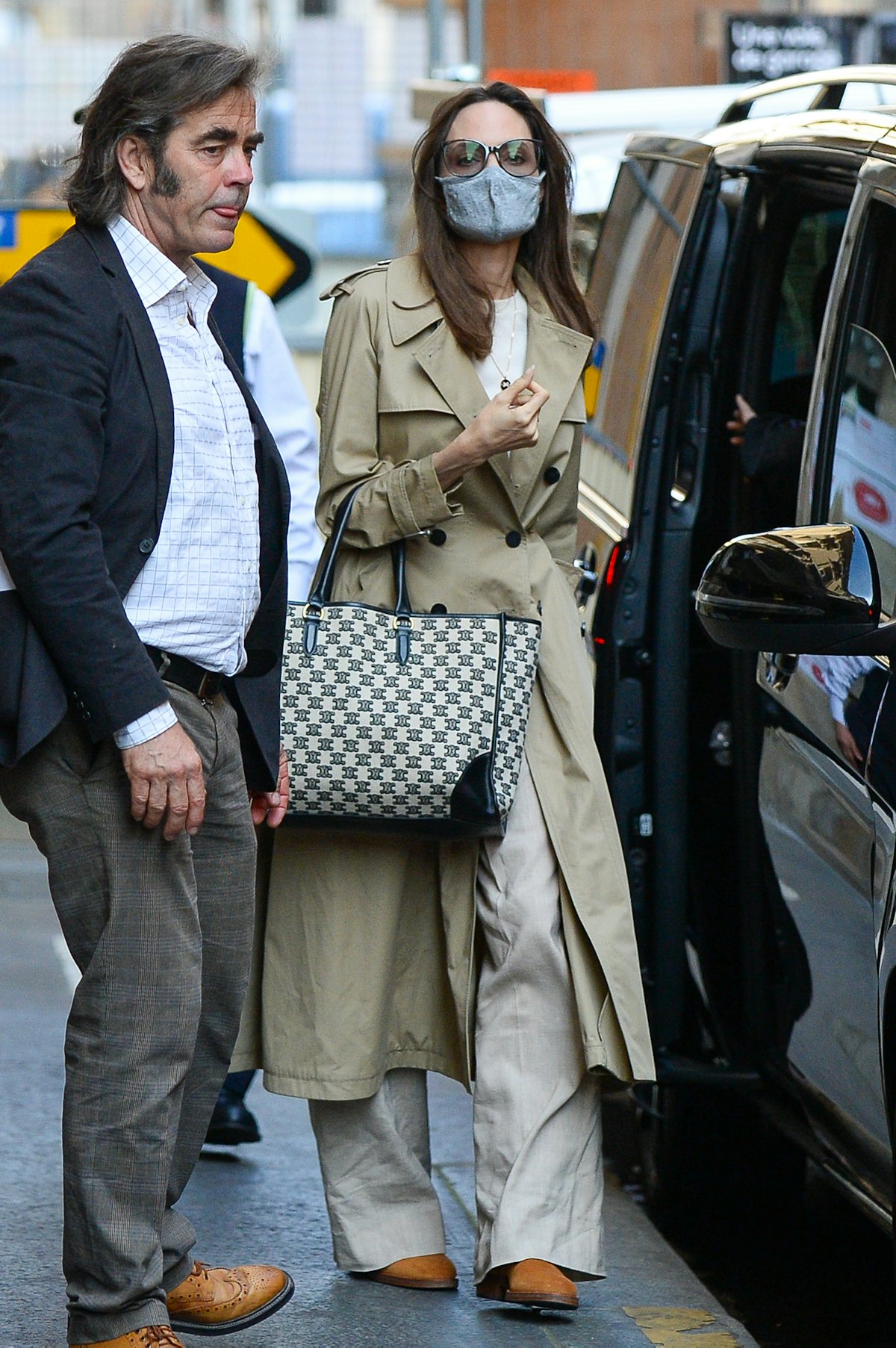 Angelina Jolie in a trench coat