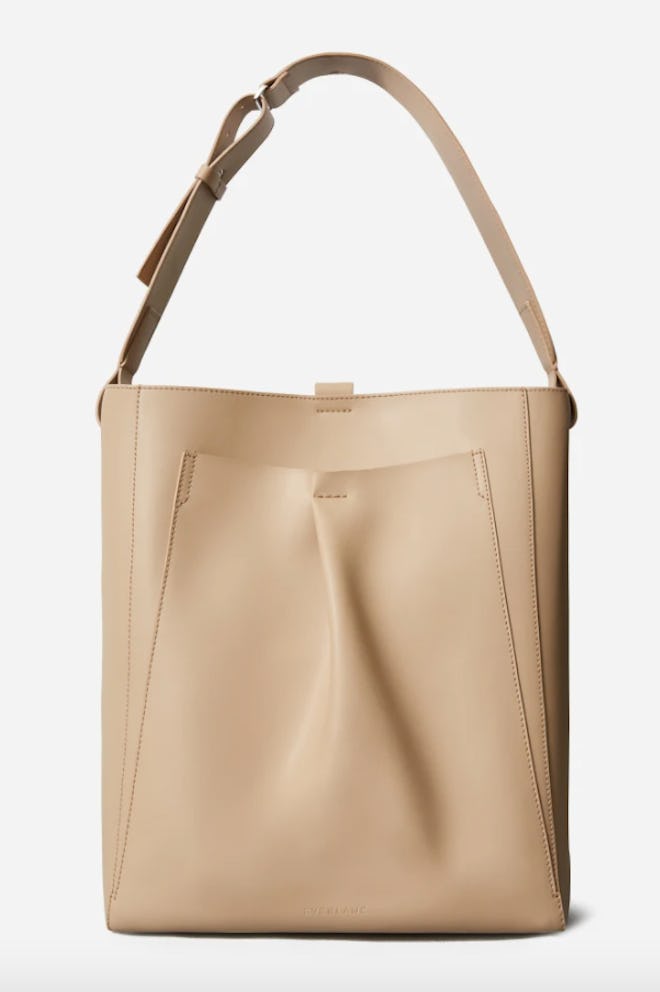 Everlane's Italian Leather Studio Bag In Light Taupe that can fit a laptop.